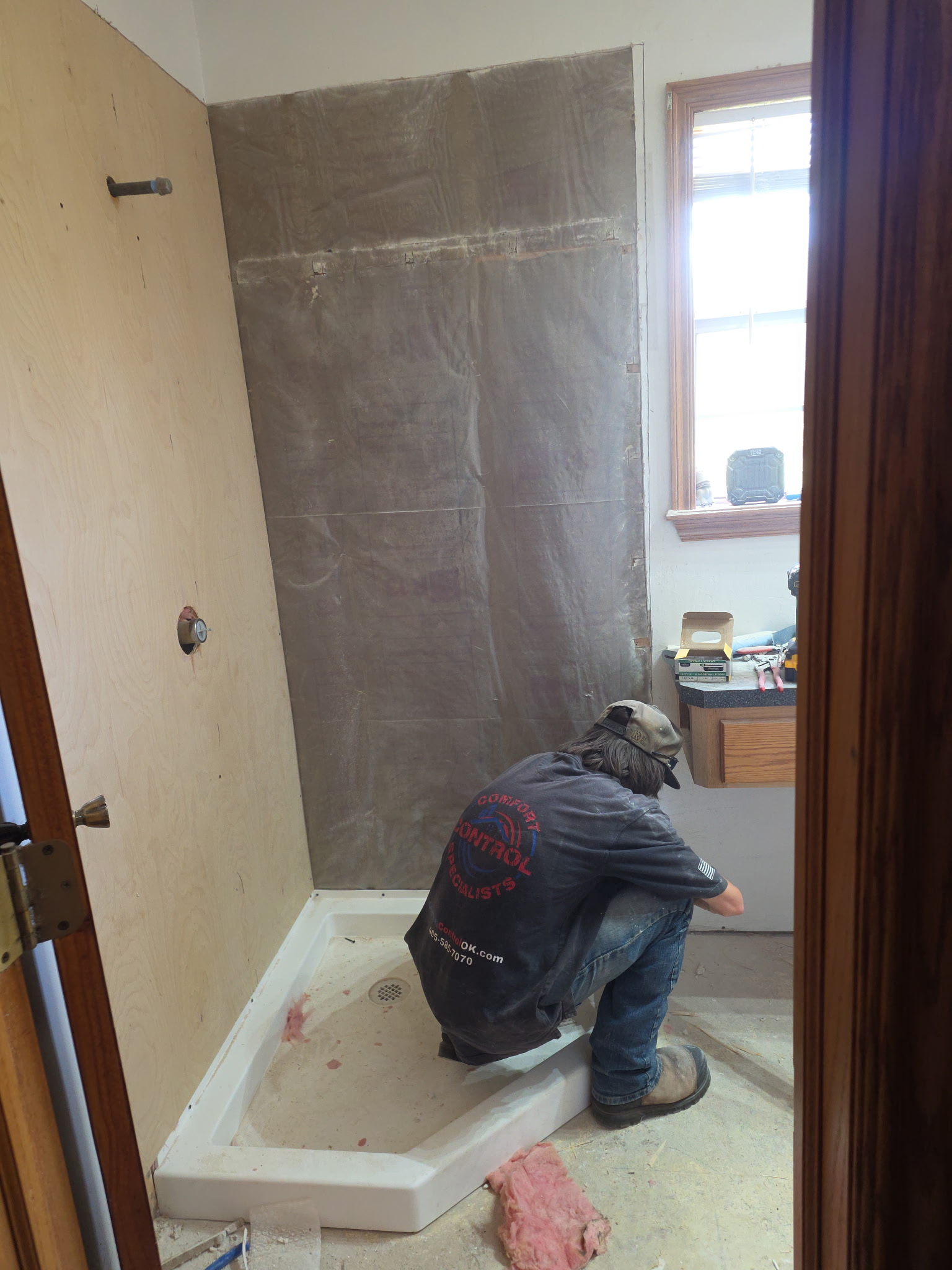 Professional HVAC maintenance technician checking air conditioning system