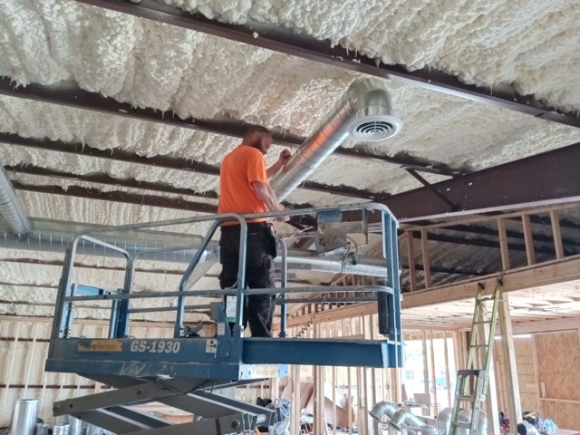 Comfort Control Specialists technician using precision tools during HVAC service